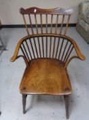 A nineteenth century elm stick backed armchair