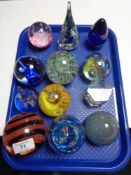 Twelve decorative glass paperweights.