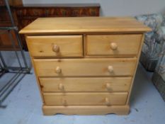 A pine five drawer chest