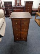 A contemporary eight drawer chest with brass handles
