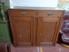 An early twentieth century oak sideboard
