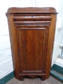 A nineteenth century mahogany corner cabinet