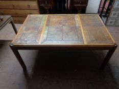 A tiled mahogany coffee table