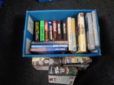A box of books including Michael Palin,