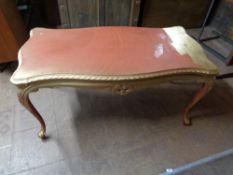 A contemporary gilded low table