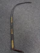 A nineteenth century leather and brass mounted whip
