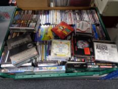 A crate of very large quantity of CDs and DVDs