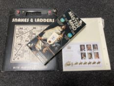 A vintage Master Mind logic game together with Snakes and Ladders and a Limited edition 60th