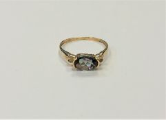 A 10ct gold mystic topaz ring, 8 mm x 6 mm stone, size M/N.