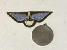 A Parachute regiment cloth badge and medal