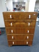 A 1930's walnut five drawer chest