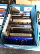 A box of books including Andy McNab, Patricia Cornwell,
