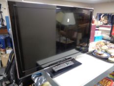 A Panasonic 32 inch LCD TV with remote