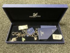 A Swarovski crystal charm bracelet, with retail tags and box.