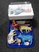 Three Cow Parade figures, a Disney figure 