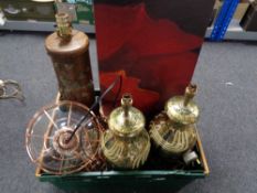 A crate of table lamps, metal framed ceiling lights,