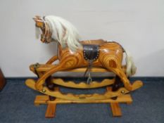 A good quality wooden rocking horse CONDITION REPORT: 112cm long by 41cm wide by