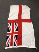 A British White ensign flag CONDITION REPORT: This measures 180cm by 93cm.