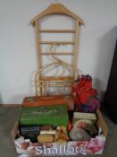 A suit valet stand together with a box of cases, wallets,