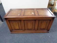 An oak linen fold blanket box