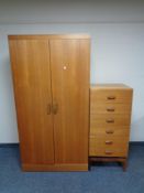 A mid twentieth century teak G-plan double door wardrobe together with six drawer chest
