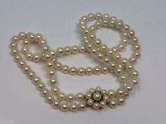 A good double 16 inch strand of pearls with pearl and gold catch CONDITION REPORT: