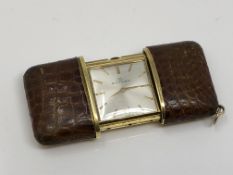 A Movado travelling watch, self winding.
