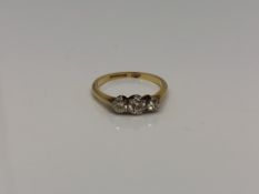 An antique 18ct gold three stone diamond ring, approx. 0.