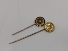 Two gold stick pins; one depicting a sphinx,