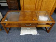 A G-plan glass topped coffee table fitted with a drawer