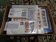 A box of first day covers and stamps,