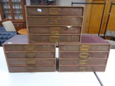 Three banks of four office stationary drawers