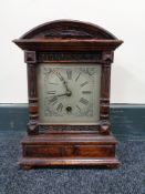 An Edwardian stained beech mantel clock