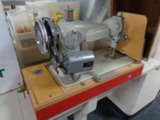 An mid century sewing machine by Acadex