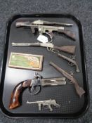 A collection of miniature rifles and pistols,