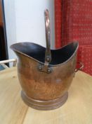 An antique copper coal helmet