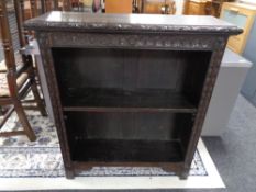 A nineteenth century carved oak bookcase