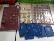 A folder of coins, UK and world coins,