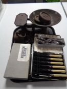 A tray of cutlery, cast iron weights,