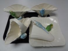 A tray of ceramic budgerigar,