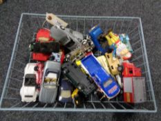 A wire basket containing mid century and later die cast vehicles, Corgi,