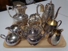 A three piece silver plated tea service, together with various other plated wares, teapot,