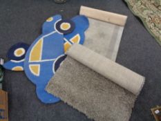 A contemporary shaggy pile rug together with three further rugs