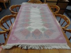 Two pink contemporary carpets