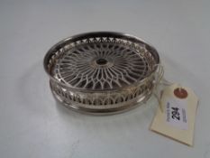 A silver bottle coaster, Walker & Hall, Birmingham 1930.