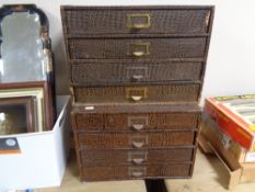 A set of two banks of four office storage drawers