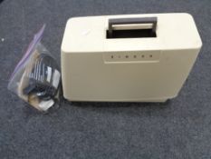 A Singer 378 sewing machine with foot pedal and instructions