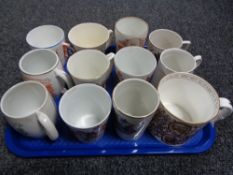 A tray of antique commemorative beakers, coronation souvenirs,