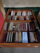 Two stands containing compqact discs.