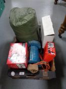 A box of sleeping bag, security floodlight, bench grinder,